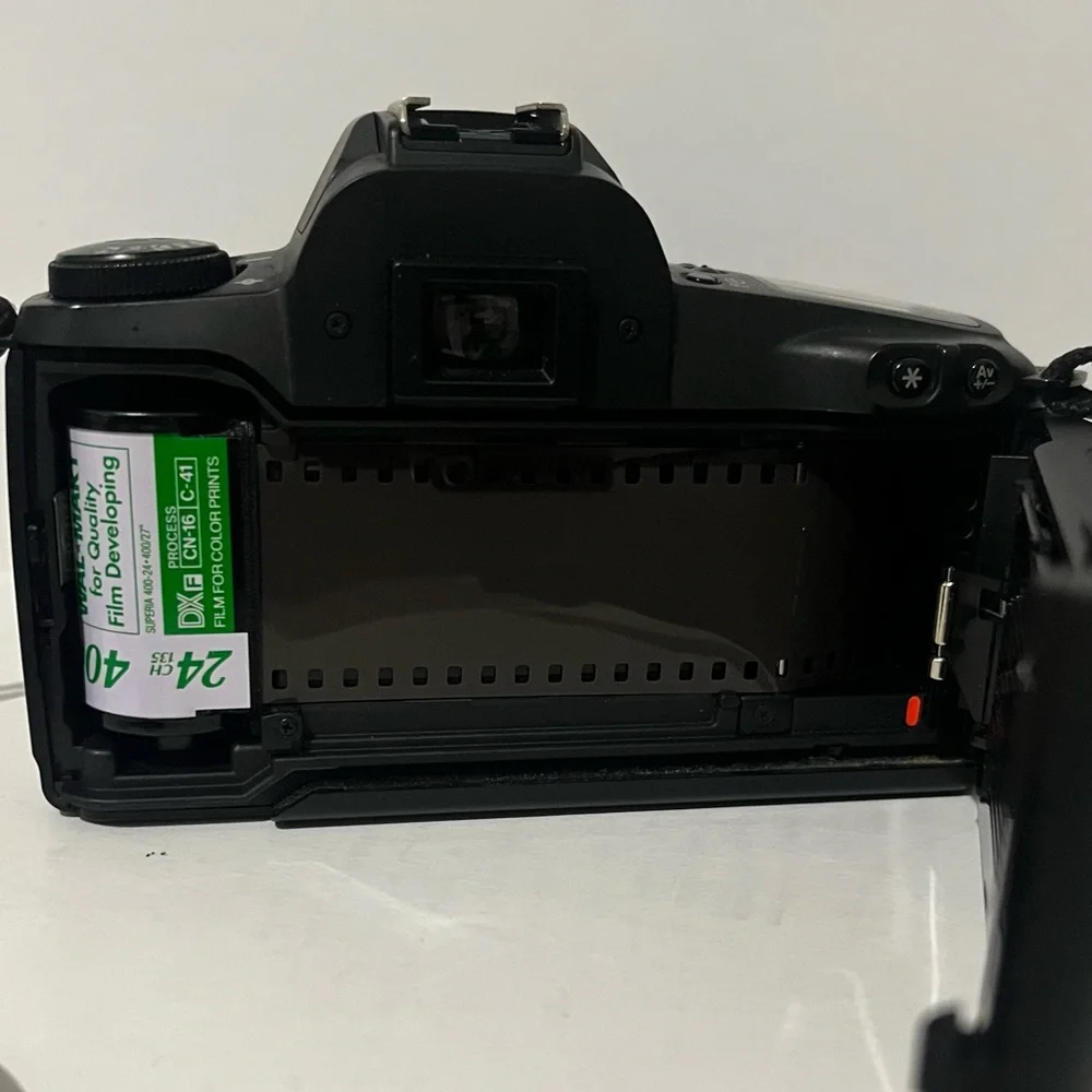 Canon EOS Rebel Camera with Black and Red Strap